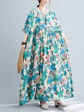 Robe à fleurs imprimée à smocks pour le déjeuner sur la plage